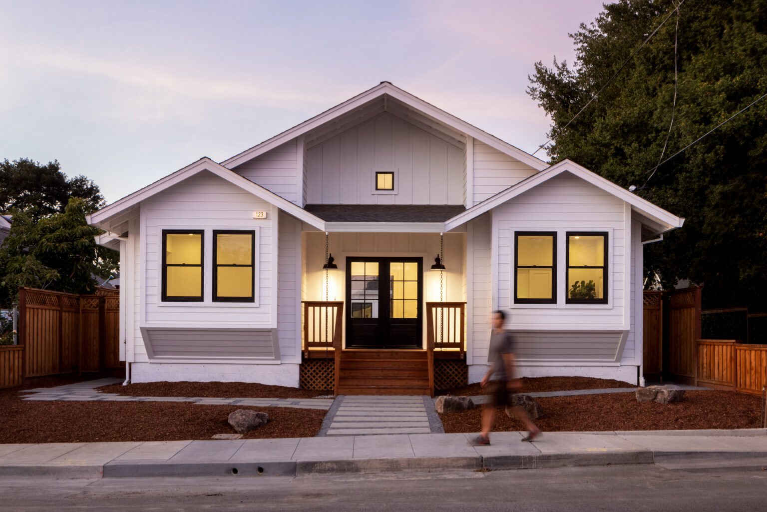 Exterior of a white Healdsburg home at dusk