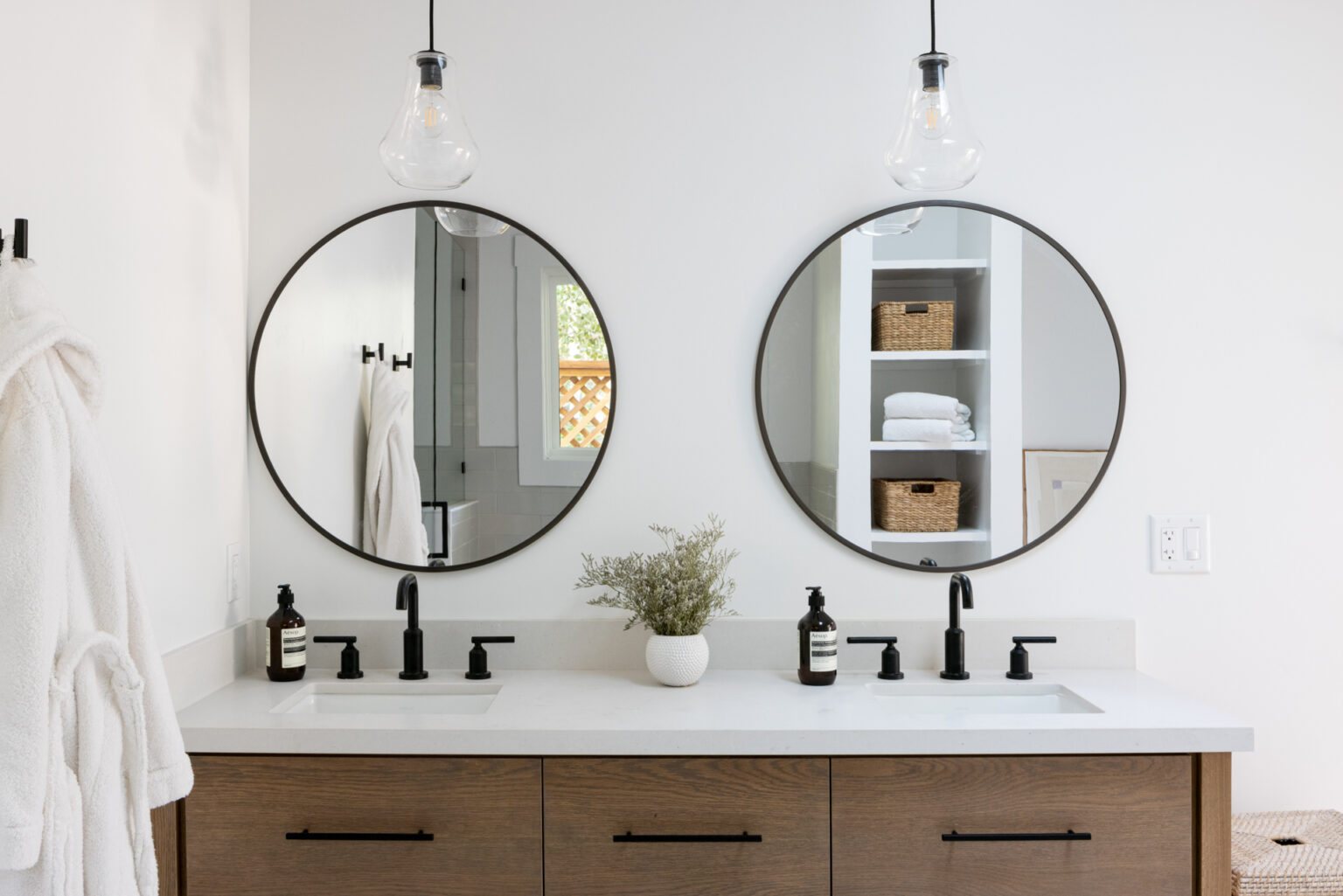 Bathroom with double vanity and round mirrors